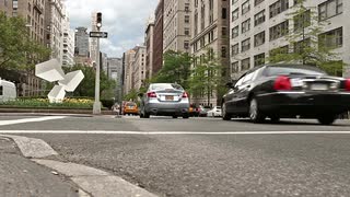 cars-driving-in-park-avenue-traffic-in-midtown-manhattan-low-street-view-on-ground-crosswalk-lines-nyc-1080-hd_4yr7p_a7__S0000